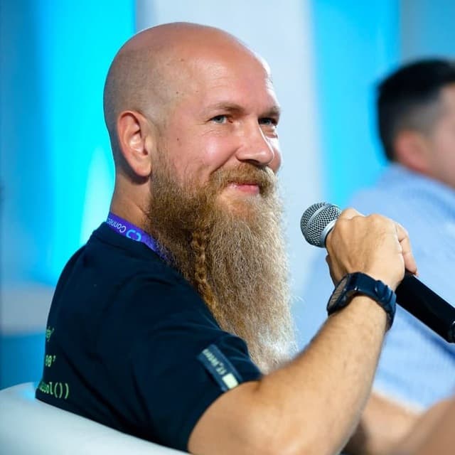 Oleg Reshetnikov speaking at a professional event in Cyprus